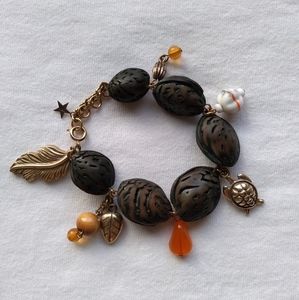 'peach pit' charm bracelet